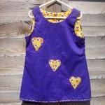 Girls purple pinafore heart..
