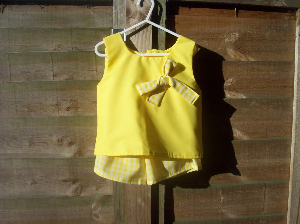 Girls yellow sleeveless top and shorts set 